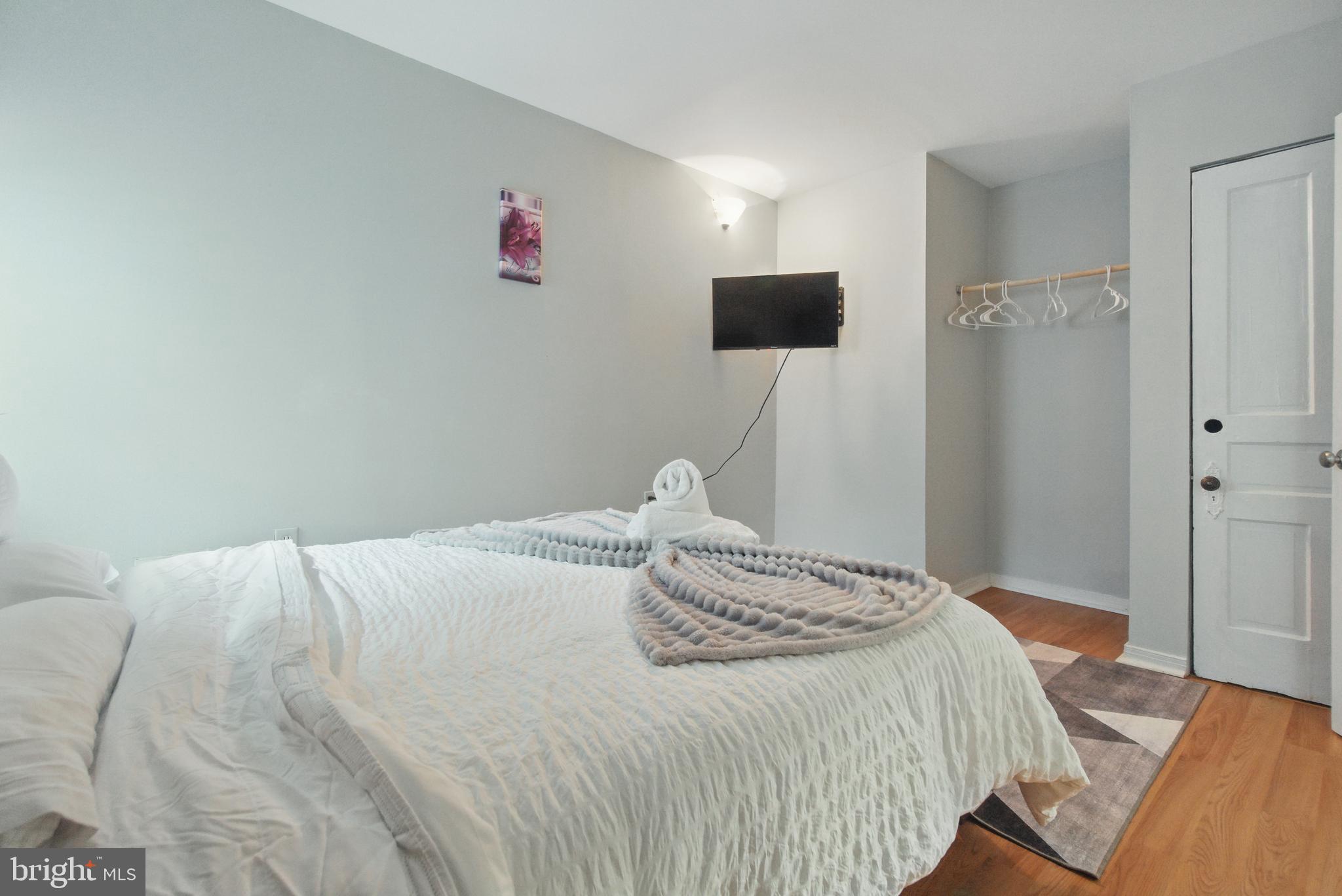 28 T Street Northwest, Unit 3 Washington, DC 20001 - Photo 19 of 34 a bedroom with a bed and a tv