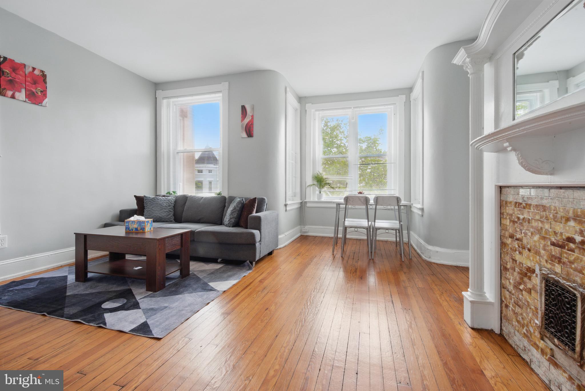 28 T Street Northwest, Unit 3 Washington, DC 20001 - Photo 20 of 34 a living room with furniture and a fireplace