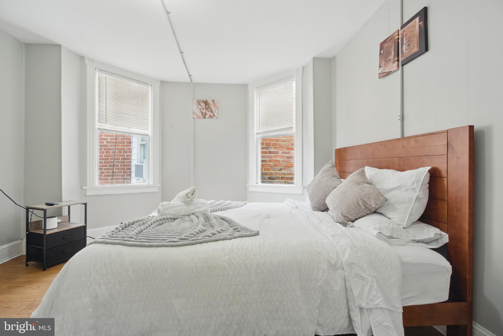 28 T Street Northwest, Unit 3 Washington, DC 20001 - Photo 22 of 34 a bedroom with a large bed and a window