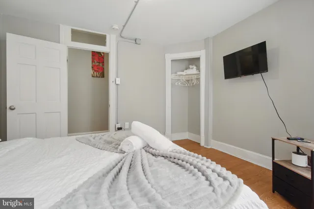 a bedroom with a bed and window