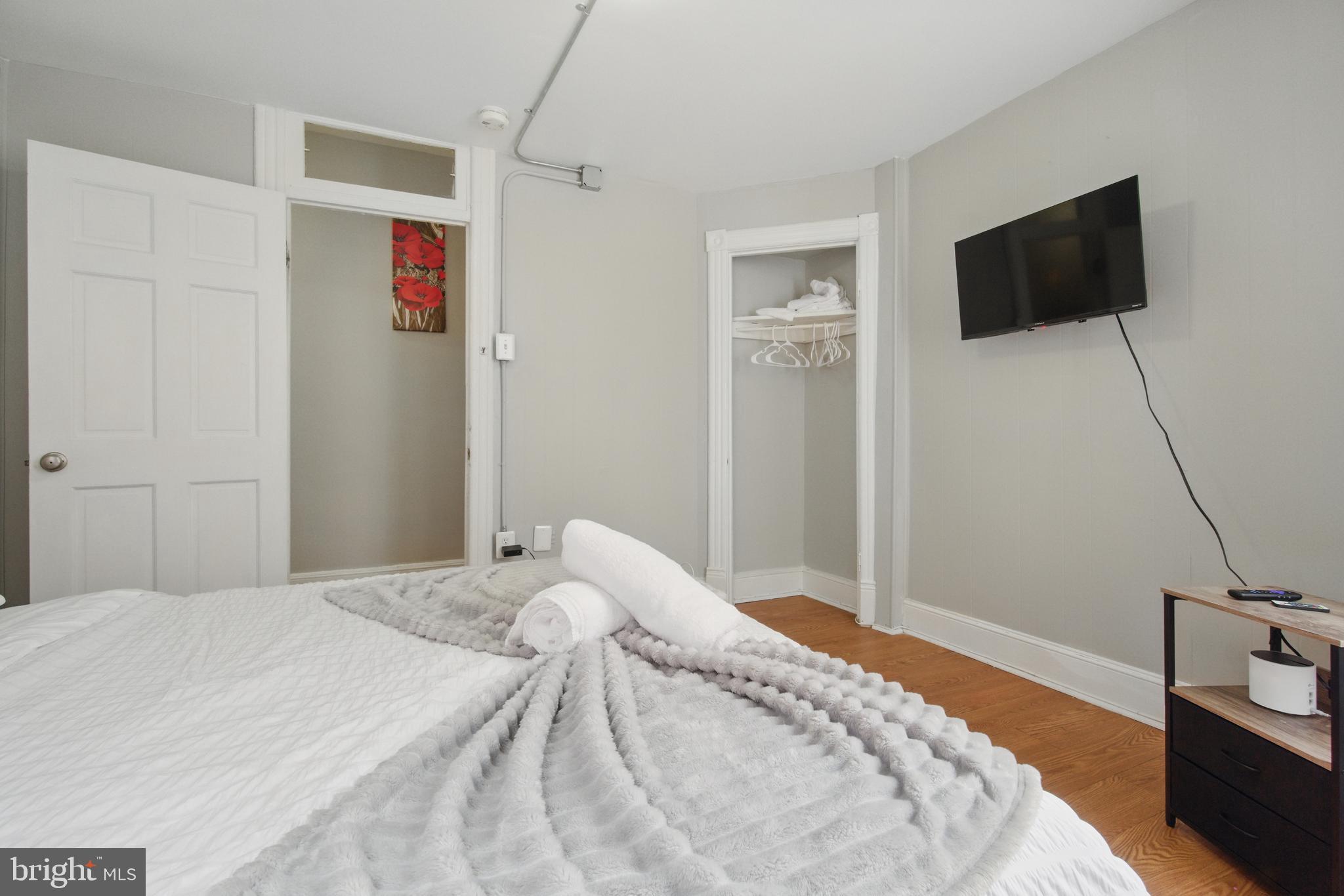 28 T Street Northwest, Unit 3 Washington, DC 20001 - Photo 23 of 34 a bedroom with a bed and a flat screen tv