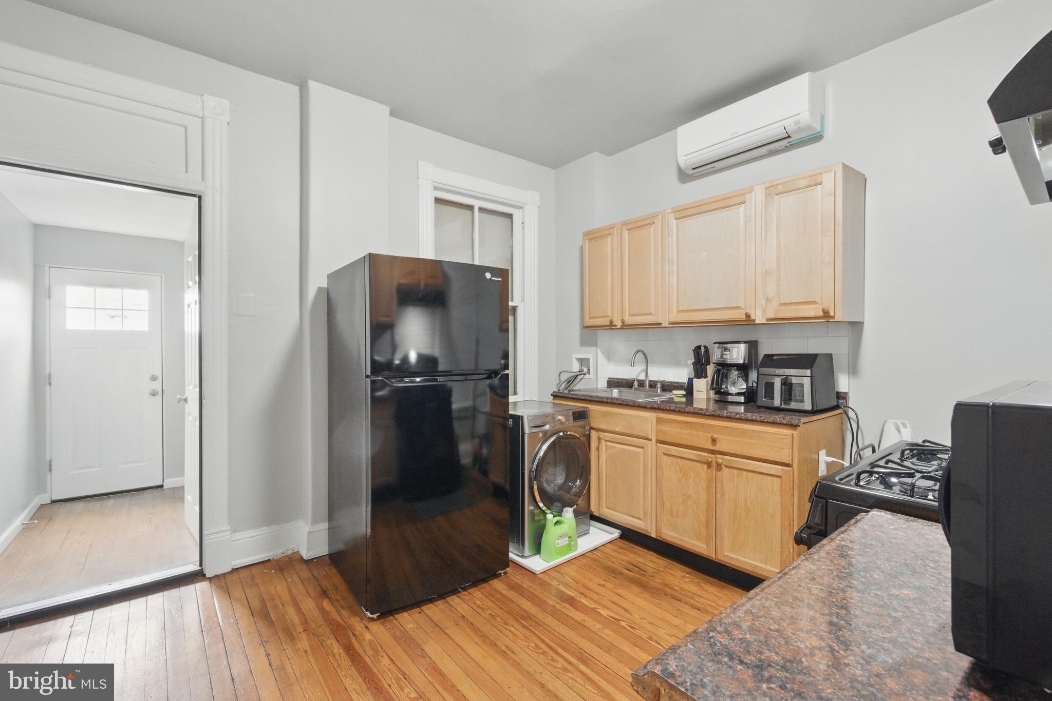 28 T Street Northwest, Unit 3 Washington, DC 20001 - Photo 25 of 34 a kitchen with granite countertop a refrigerator stove top oven and sink