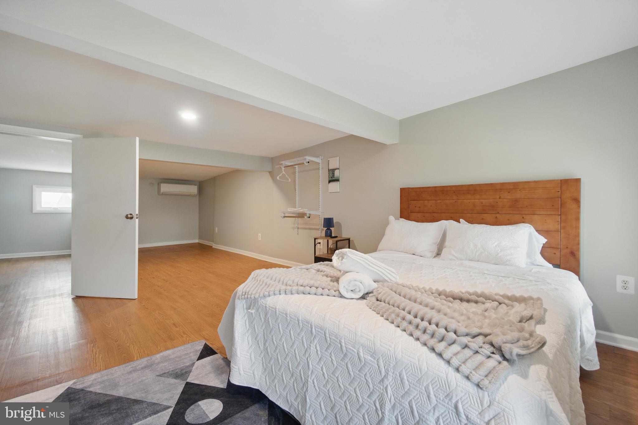 28 T Street Northwest, Unit 3 Washington, DC 20001 - Photo 27 of 34 a bedroom with a bed and wooden floor