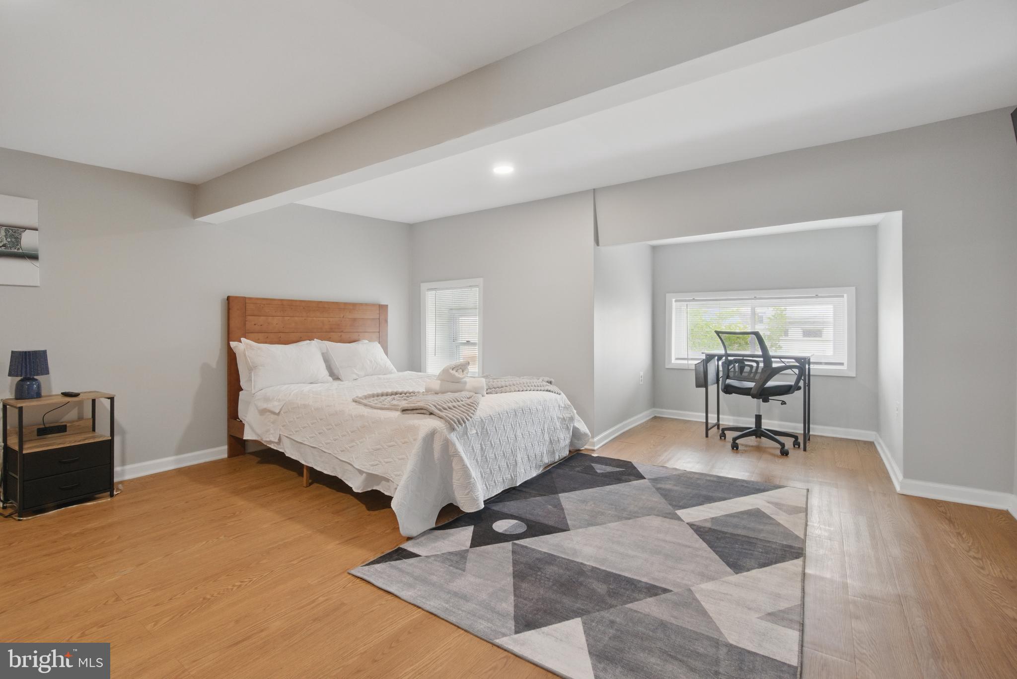 28 T Street Northwest, Unit 3 Washington, DC 20001 - Photo 4 of 34 a bed room with a bed and furniture