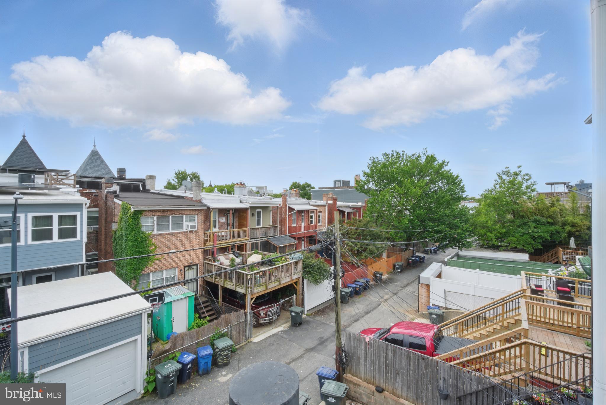 28 T Street Northwest, Unit 3 Washington, DC 20001 - Photo 5 of 34 a view of a roof deck with couches and wooden floor