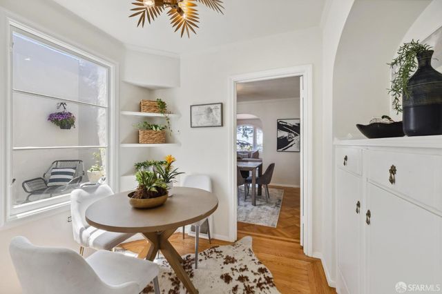 a dining room with furniture and window
