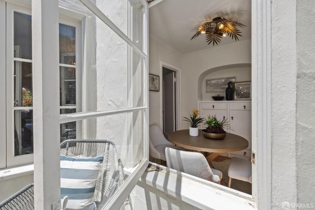 a room with furniture and a potted plant