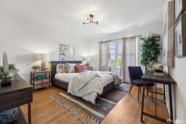 a bed room with bed and a window