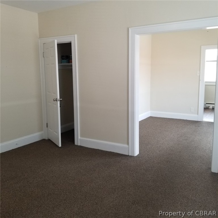 75 South Main Street, Unit 1 Kilmarnock, VA 22482 - Photo 4 of 9 an empty room with closet area