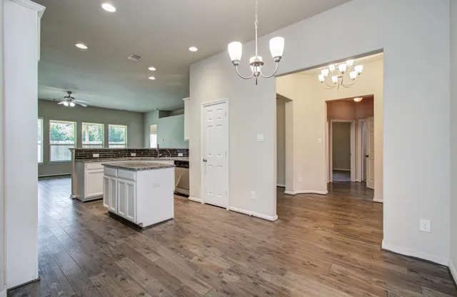 a view of a kitchen and a chandelier