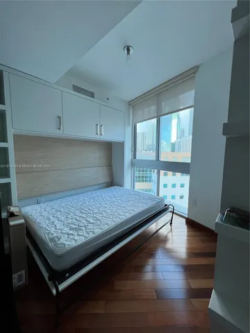 a kitchen with kitchen island a counter top space and a wooden floor