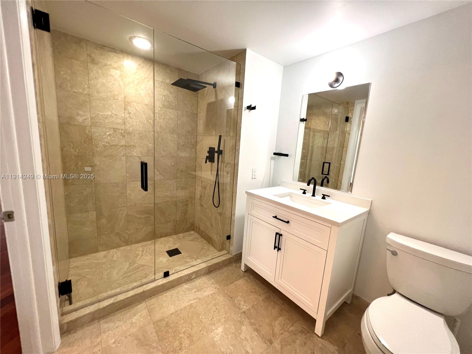 350 South Miami Avenue, Unit 1502 Miami, FL 33130 - Photo 13 of 30 a bathroom with a sink a toilet and shower