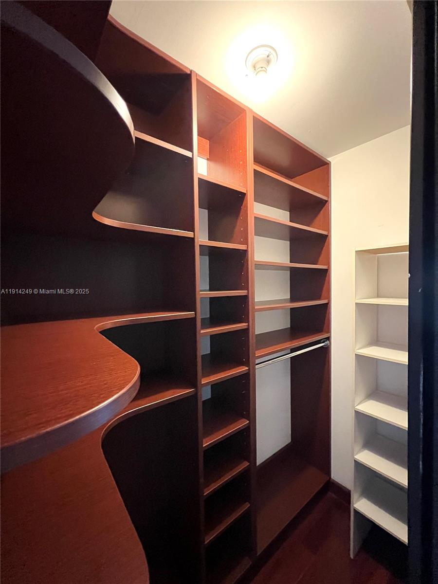 350 South Miami Avenue, Unit 1502 Miami, FL 33130 - Photo 20 of 30 a view of walk in closet with empty racks