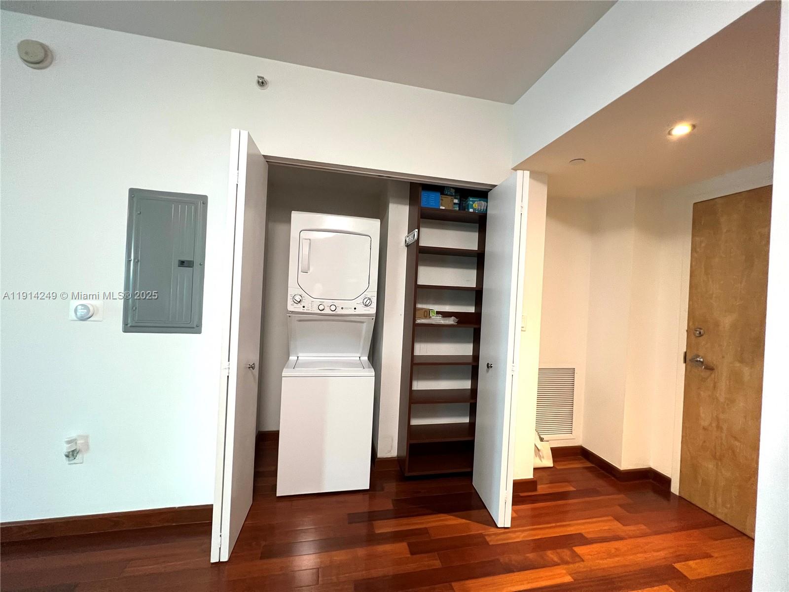 350 South Miami Avenue, Unit 1502 Miami, FL 33130 - Photo 22 of 30 a view of walk in closet with wooden floor