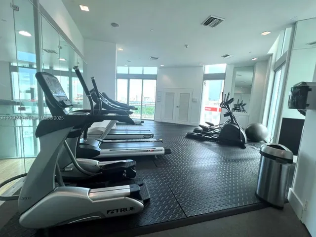 a room with lots of furniture and wooden floor