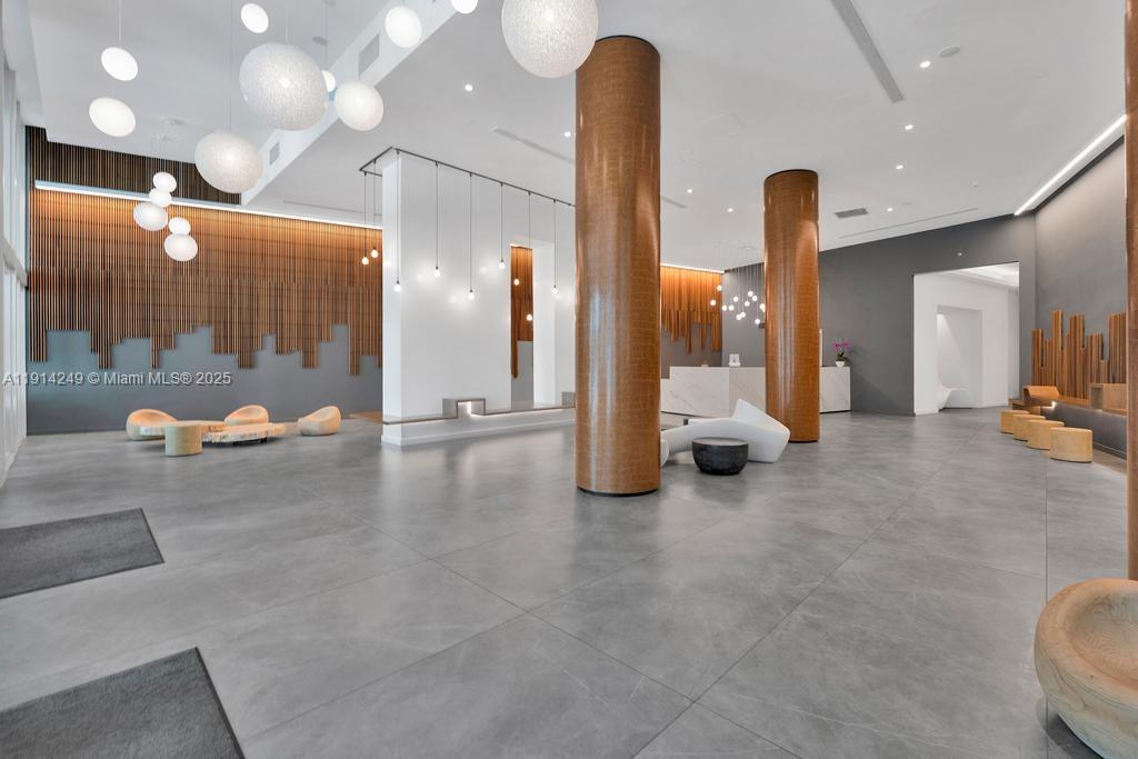 350 South Miami Avenue, Unit 1502 Miami, FL 33130 - Photo 29 of 30 a view of a hall with floor to ceiling window and glass door