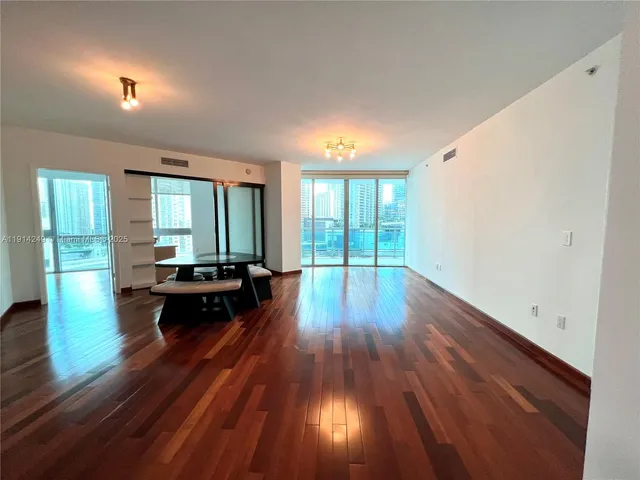 wooden floor in a hall with a window