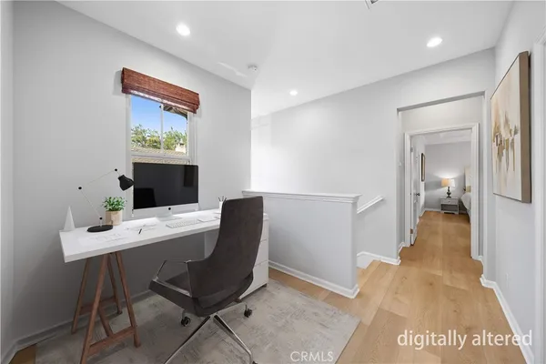 a large bed sitting in a bedroom next to a window