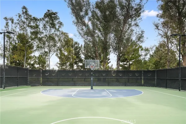 a view of car parked on the side of a street