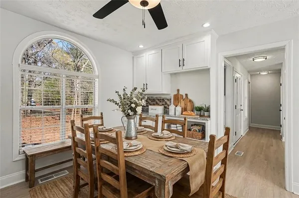 a view of a dining room with furniture window and outside view