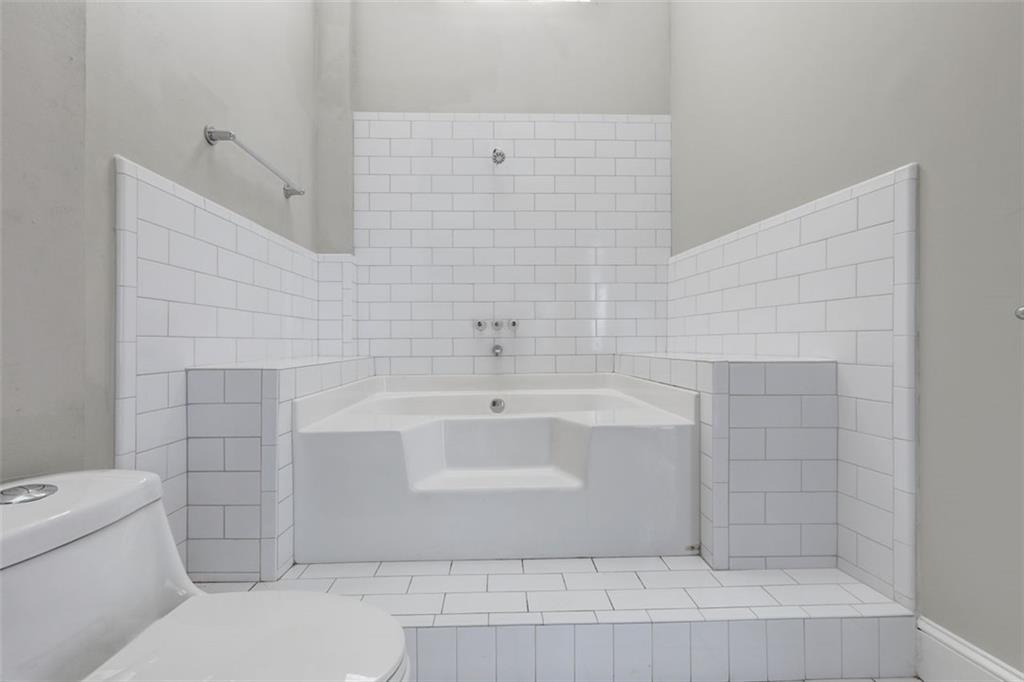 161 Mangum Street Southwest, Unit 302 Atlanta, GA 30313 - Photo 12 of 33 a bathroom with a sink and toilet