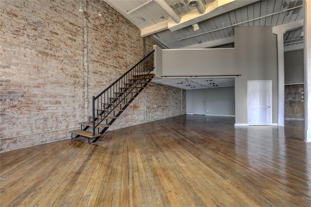 161 Mangum Street Southwest, Unit 302 Atlanta, GA 30313 - Photo 18 of 33 a view of entryway with wooden floor