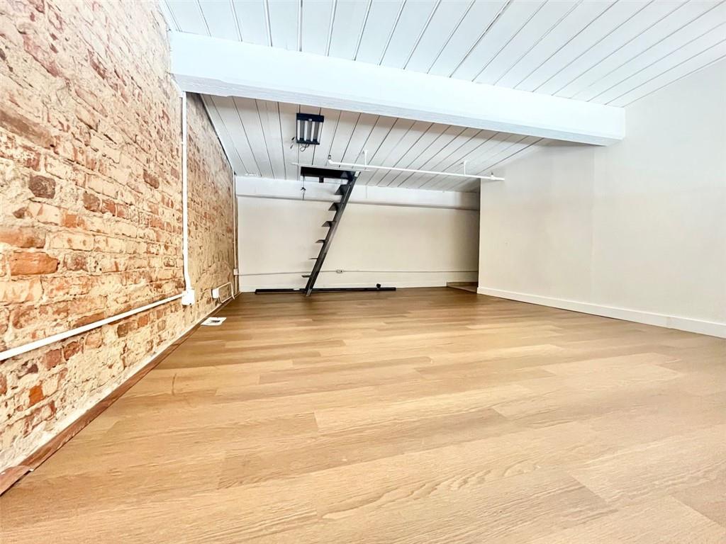 161 Mangum Street Southwest, Unit 302 Atlanta, GA 30313 - Photo 20 of 33 a view of an empty room with stairs