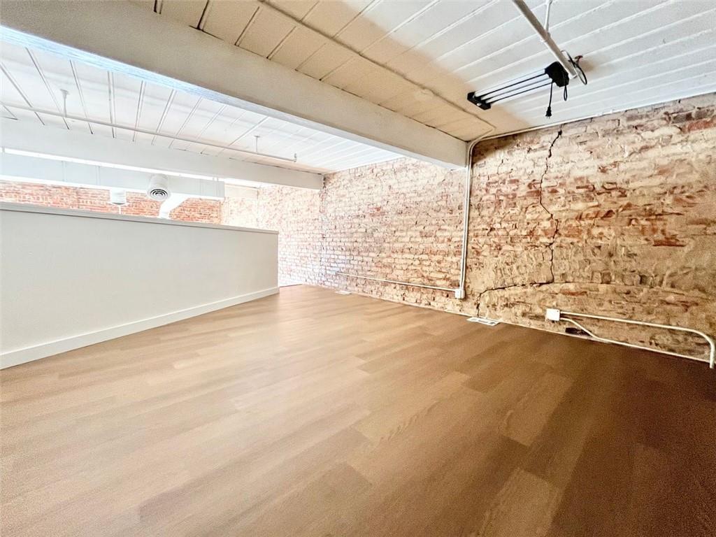 161 Mangum Street Southwest, Unit 302 Atlanta, GA 30313 - Photo 21 of 33 a view of an empty room with a window