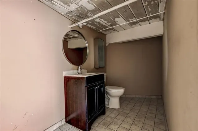 a bathroom with a toilet and a sink