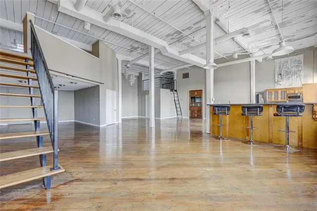 a view of a hall with wooden floor