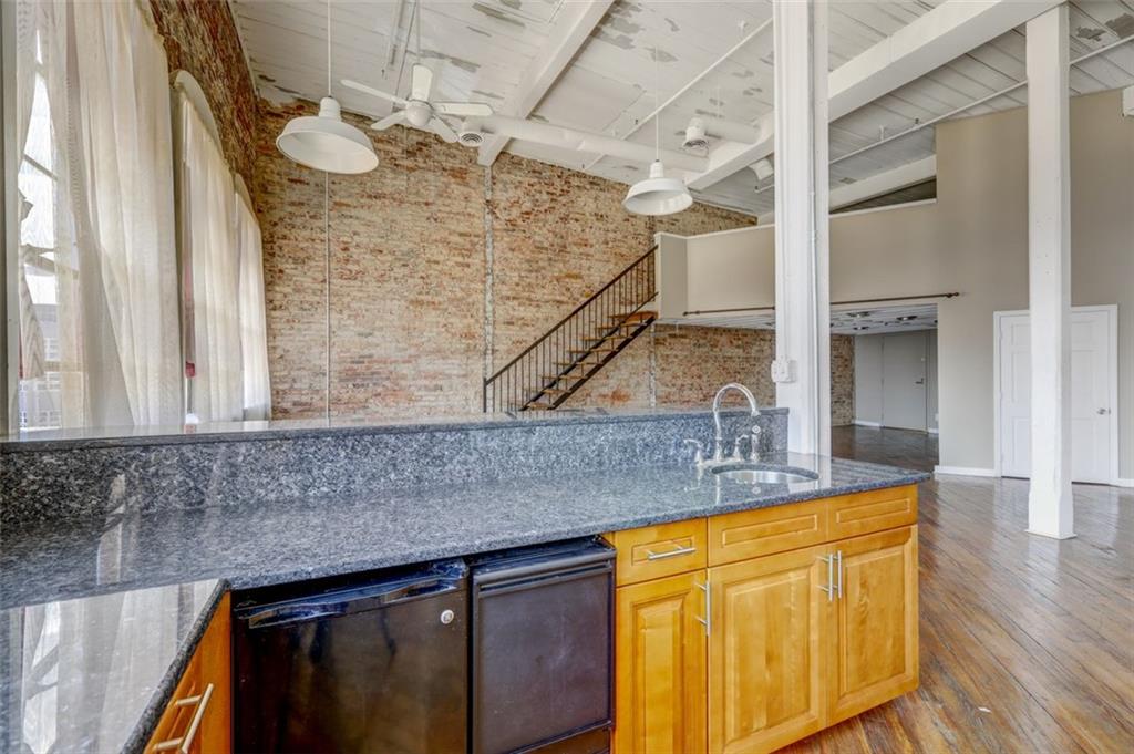 161 Mangum Street Southwest, Unit 302 Atlanta, GA 30313 - Photo 5 of 33 a bathroom with a sink and a mirror