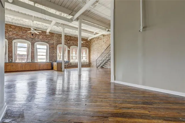 a view of an entryway with wooden floor