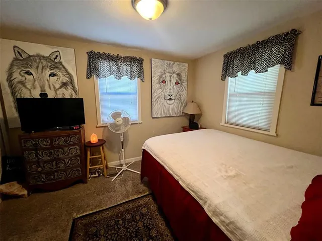 a bathroom with a toilet a sink and a mirror