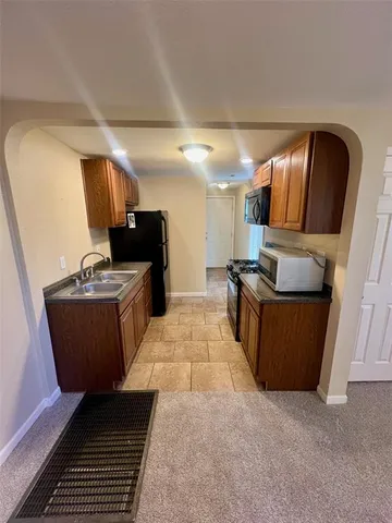 a room with furniture and a flat screen tv