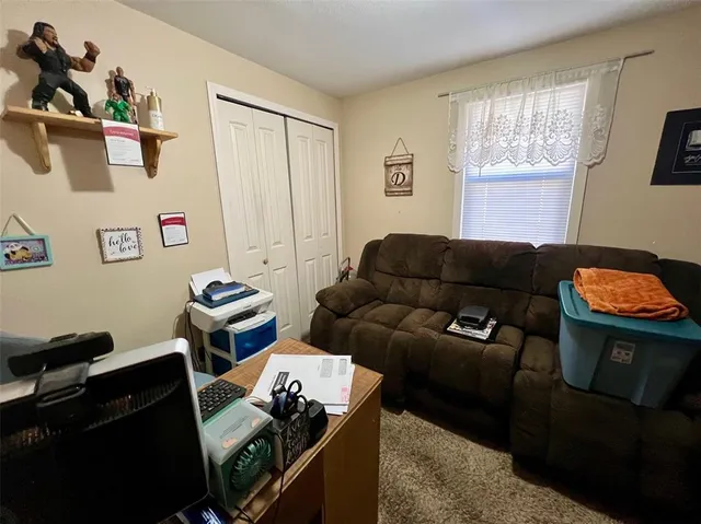 a room with furniture and flat screen tv