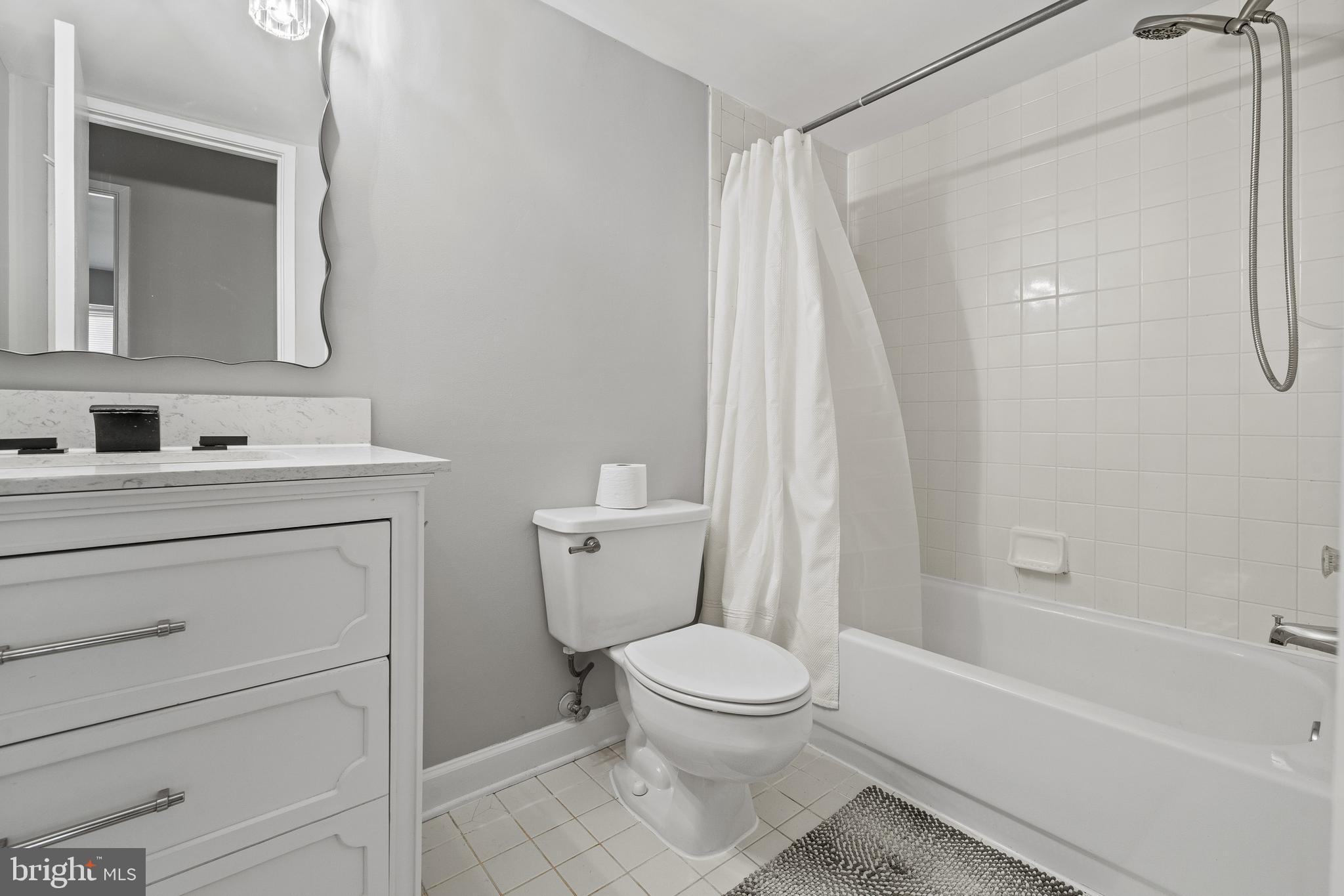 7804 Inverton Road, Unit 201 Annandale, VA 22003 - Photo 11 of 16 a bathroom with a sink a toilet and shower