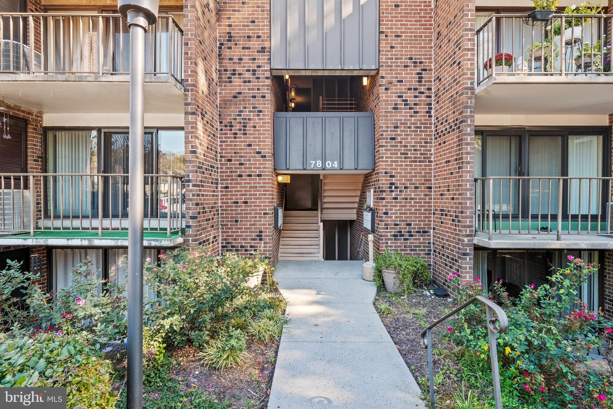 7804 Inverton Road, Unit 201 Annandale, VA 22003 - Photo 15 of 16 a backyard of a house with lots of green space