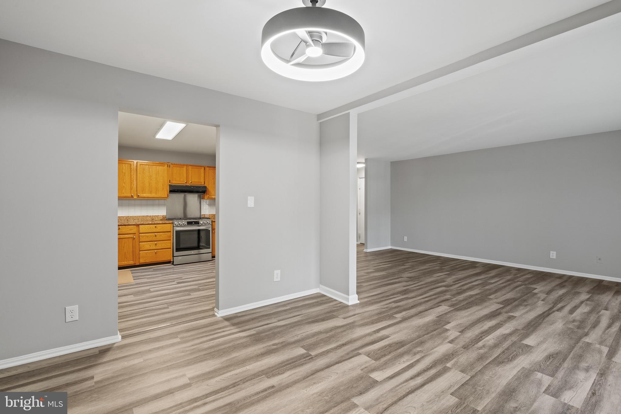 7804 Inverton Road, Unit 201 Annandale, VA 22003 - Photo 5 of 16 wooden floor in an empty room with a window