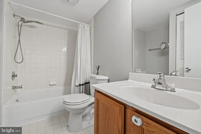 a bathroom with a sink a toilet and a bathtub