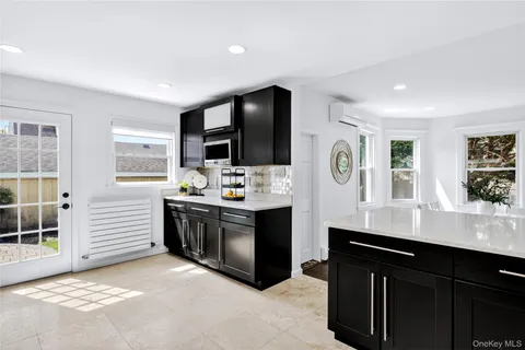 a kitchen with stainless steel appliances a sink stove and refrigerator