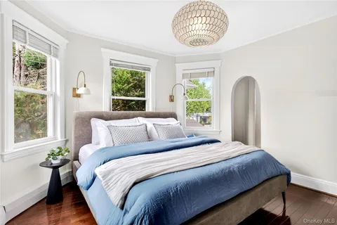 a bedroom with a large bed and a window