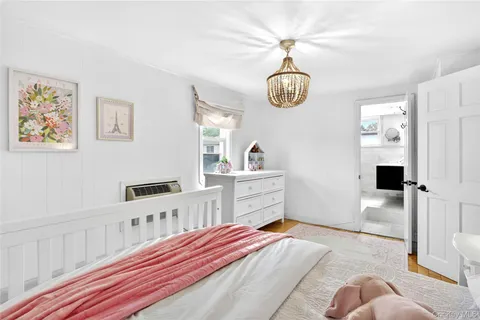 a bedroom with furniture and window