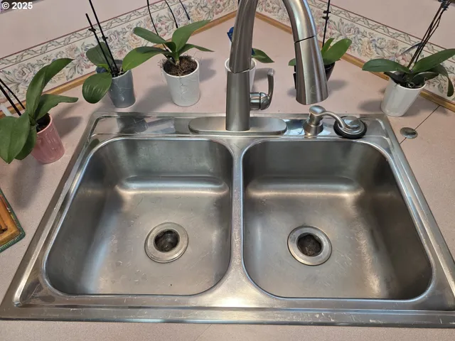 a kitchen with sink cabinets and window