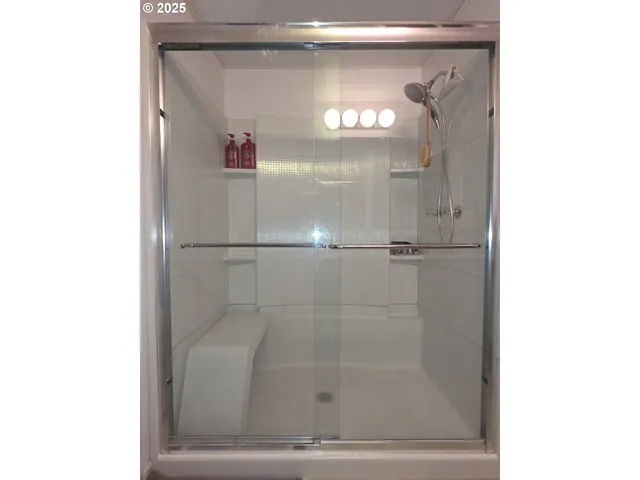 a bathroom with a sink vanity and a mirror