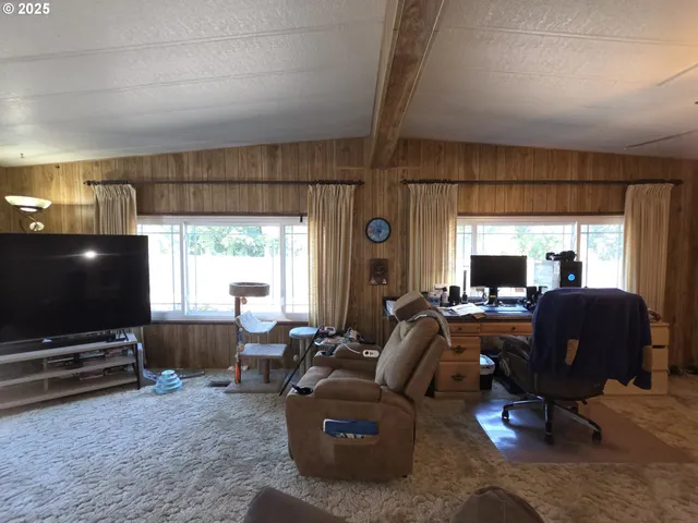 a view of a chairs and table in the patio