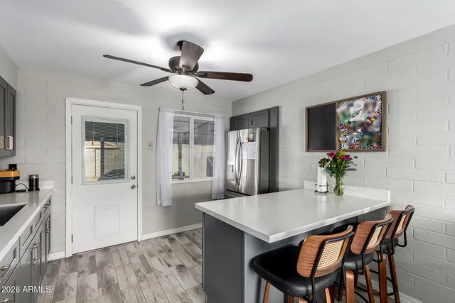 a kitchen with a sink a stove and cabinets