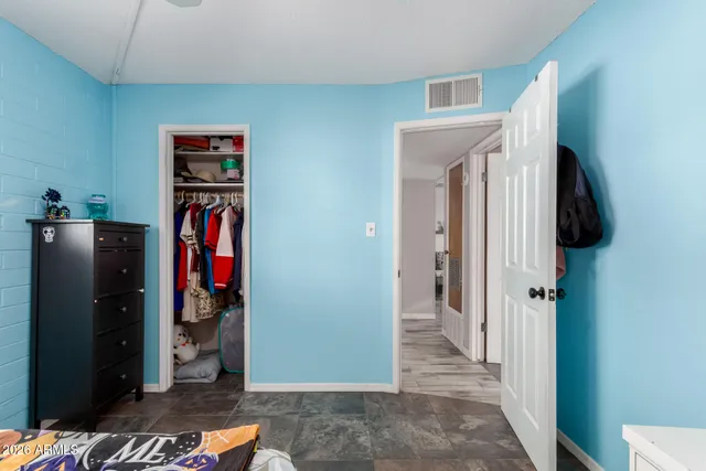 a view of a patio with table and chairs next to a yard