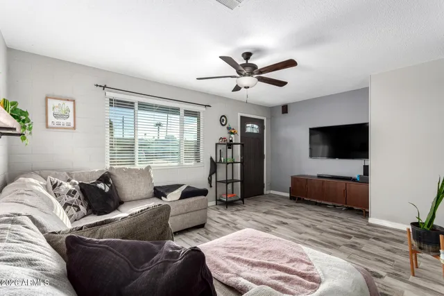 a living room with furniture and a large window