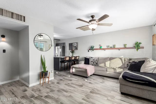 a kitchen with granite countertop white cabinets and stainless steel appliances