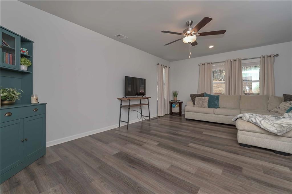 294 Muskogee Drive Dallas, GA 30132 - Photo 11 of 32 a living room with furniture and a flat screen tv